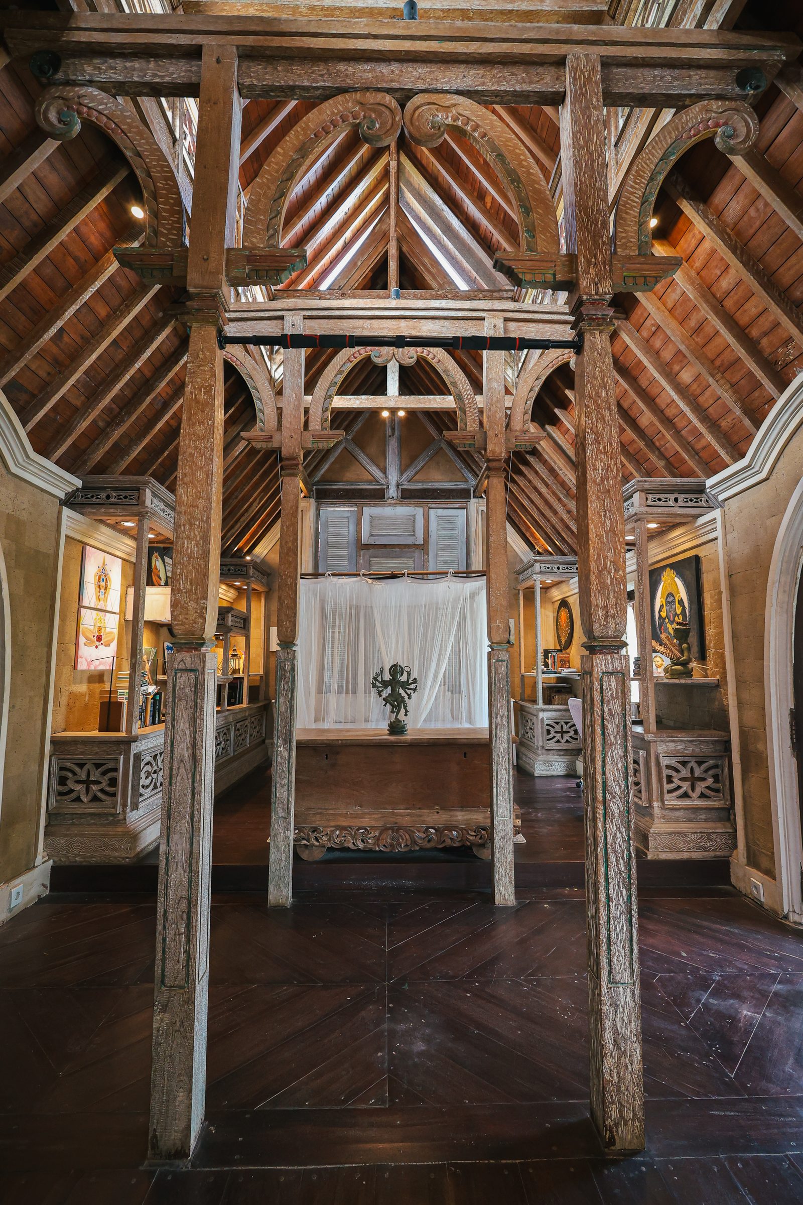 Carved timber bed in a private room